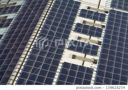 Aerial view of the roof covered with solar panels, at daytime Aerial view of the roof covered with solar panels, at daytime 139628254