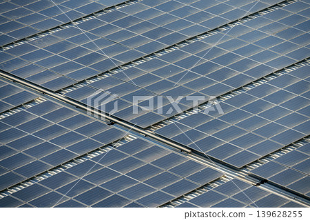 Aerial view of a field of solar panels, at daytime 139628255