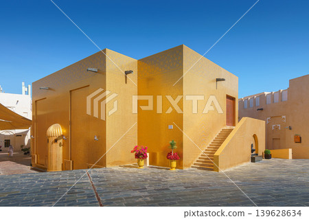 Doha, Qatar - Jan 14 2024, Panoramic view of Golden Mosque decorated with golden tiles, in Katara cultural village at daytime with blue sky, Doha, Qatar Doha, Qatar - Jan 14 2024, Panoramic view of Golden Mosque decorated with golden tiles, in Katara cultural village at daytime with blue sky, Doha, Qatar 139628634