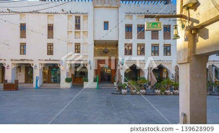 Doha, Qatar - Jan 14 2024, Panoramic view of the wide pedestrian street in the Souq Waqif bazaar area, without people, at daytime, Doha, Qatar Doha, Qatar - Jan 14 2024, Panoramic view of the wide pedestrian street in the Souq Waqif bazaar area, without people, at daytime, Doha, Qatar 139628909
