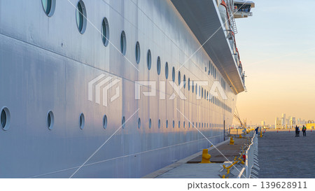 Doha, Qatar - Jan 14 2024, Panoramic view of the side of the moored MSC Virtuosa cruise ship and the dock, in the port of Doha, at evening, Doha, Qatar 139628911