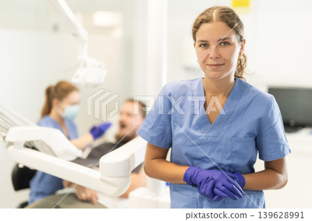 Female dentist invites you to visit dental clinic Female dentist invites you to visit dental clinic 139628991
