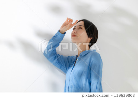 A woman standing in the sun peppermint day A woman standing in the sun peppermint day 139629808