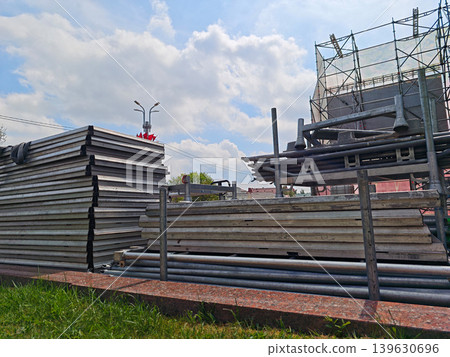 Stacks of metal scaffolding and construction panels Stacks of metal scaffolding and construction panels 139630696