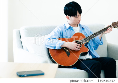 Man playing guitar Man playing guitar 139630852