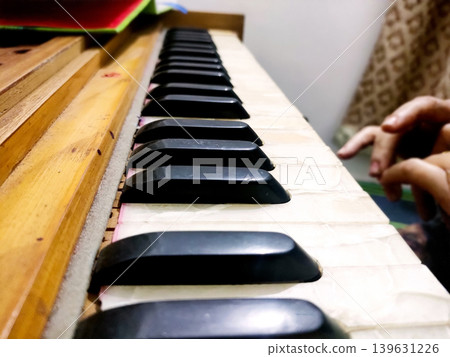 Woman Hand Playing Harmonium Keyboard. Traditional Indian Musica 139631226