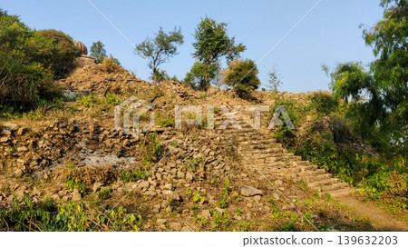Ancient stone staircase leading to Tilla Jogian temple ruins Ancient stone staircase leading to Tilla Jogian temple ruins 139632203