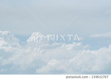 Soft white clouds floating across pale blue sky with peaceful atmosphere and airy natural background ideal for weather and nature themes Soft white clouds floating across pale blue sky with peaceful atmosphere and airy natural background ideal for weather and nature themes 139632767