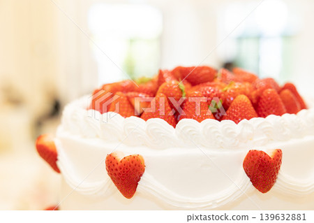 A picture of a big cream cake with lots of strawberries on top Wedding cake A picture of a big cream cake with lots of strawberries on top Wedding cake 139632881