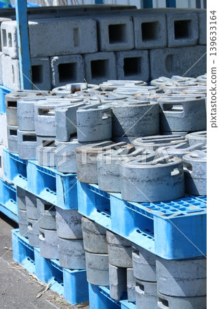 A stack of heavy weights; an image of a construction site, etc. A stack of heavy weights; an image of a construction site, etc. 139633164
