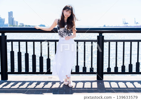 Japanese ballerina dancing against the backdrop of the sea Japanese ballerina dancing against the backdrop of the sea 139633579