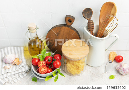 Cooking ingredients and kitchen utensils on counter Cooking ingredients and kitchen utensils on counter 139633602