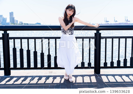 Japanese ballerina dancing against the backdrop of the sea 139633628
