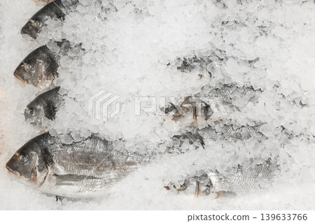Raw frozen fish cold ice fresh seafood supermarket counter sea food Raw frozen fish cold ice fresh seafood supermarket counter sea food 139633766
