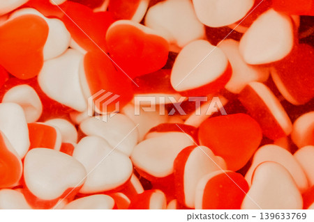 Gummies jelly sweet sugar marmalade white food candy red color background Gummies jelly sweet sugar marmalade white food candy red color background 139633769