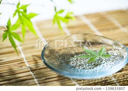 Blue maple floating on the water Blue maple floating on the water 139633807