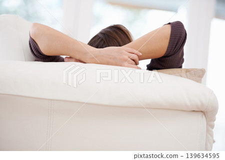 Relax, sofa and hands of woman in morning for resting on weekend, free time and break in living room. Apartment, house and person lying, comfortable and chill on couch for peace, calm and wellness Relax, sofa and hands of woman in morning for resting on weekend, free time and break in living room. Apartment, house and person lying, comfortable and chill on couch for peace, calm and wellness 139634595