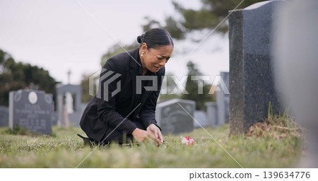 Sad woman, graveyard and crying with rose by tombstone in mourning, loss or grief at funeral or cemetery. Female person with flower in depression, death or goodbye at memorial or burial service Sad woman, graveyard and crying with rose by tombstone in mourning, loss or grief at funeral or cemetery. Female person with flower in depression, death or goodbye at memorial or burial service 139634776