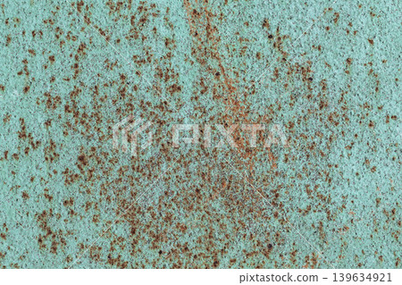 Rusty Turquoise Metal Texture. Close-up texture of weathered turquoise painted metal surface with scattered brown rust spots and oxidation patterns. Rusty Turquoise Metal Texture. Close-up texture of weathered turquoise painted metal surface with scattered brown rust spots and oxidation patterns. 139634921