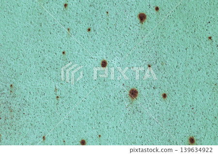 Rusty Turquoise Metal Texture. Close-up texture of weathered turquoise painted metal surface with scattered brown rust spots and oxidation patterns. Rusty Turquoise Metal Texture. Close-up texture of weathered turquoise painted metal surface with scattered brown rust spots and oxidation patterns. 139634922