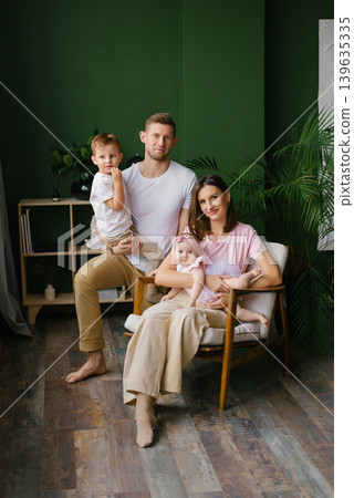 Smiling Family Portrait With Toddler And Baby At Home Smiling Family Portrait With Toddler And Baby At Home 139635335