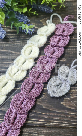 Knitting patterns with a raised pattern and yarn in different colors. Copy space Knitting patterns with a raised pattern and yarn in different colors. Copy space 139635408
