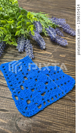 Knitting patterns with a raised pattern and yarn in different colors. Copy space Knitting patterns with a raised pattern and yarn in different colors. Copy space 139635414