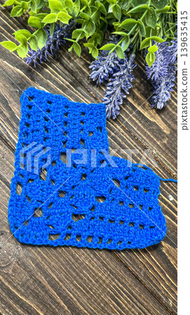 Knitting patterns with a raised pattern and yarn in different colors. Copy space Knitting patterns with a raised pattern and yarn in different colors. Copy space 139635415