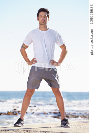 Man, fitness and portrait on beach, runner outdoor for cardio and exercise, ocean and nature with athlete. Sports, running and endurance with training or workout for health and wellness with travel 139636688