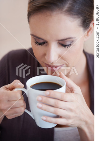 Woman, coffee and aroma, relax in apartment for comfort or morning routine with warm drink. Caffeine beverage, latte or espresso smell with peace and calm for chill at home with positive attitude Woman, coffee and aroma, relax in apartment for comfort or morning routine with warm drink. Caffeine beverage, latte or espresso smell with peace and calm for chill at home with positive attitude 139636697