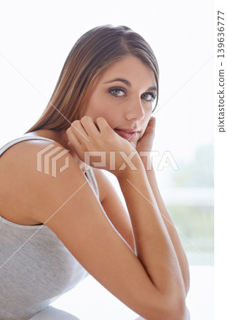 Beauty, makeup and portrait of young woman with natural, glow and glamour facial routine. Confidence, cosmetics and serious attractive female person with self care, dermatology and face treatment. Beauty, makeup and portrait of young woman with natural, glow and glamour facial routine. Confidence, cosmetics and serious attractive female person with self care, dermatology and face treatment. 139636777
