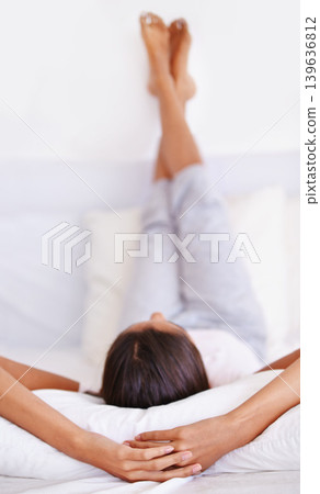 Sleeping, pillow and person relax in bedroom for comfort, cozy nap and rest on home mattress for recovery. Cushion, fatigue and sleep on cotton bedsheets with calm, peace and morning wellness Sleeping, pillow and person relax in bedroom for comfort, cozy nap and rest on home mattress for recovery. Cushion, fatigue and sleep on cotton bedsheets with calm, peace and morning wellness 139636812