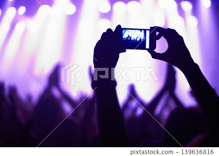 Nightclub, concert and audience with phone or lights for music, party and rave festival with silhouette and dancing. Disco, psychedelic event or performance with entertainment, crowd and smartphone Nightclub, concert and audience with phone or lights for music, party and rave festival with silhouette and dancing. Disco, psychedelic event or performance with entertainment, crowd and smartphone 139636816