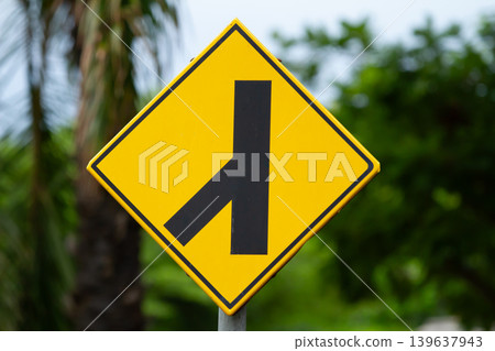 Road sign merge sign yellow sign black symbol traffic sign warning sign street sign direction sign roadside sign junction sign 139637943