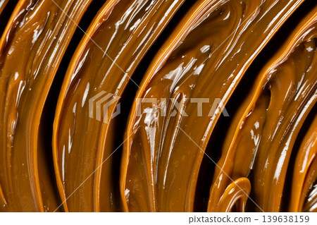 Boiled condensed milk texture or dulce de leche background Boiled condensed milk texture or dulce de leche background 139638159
