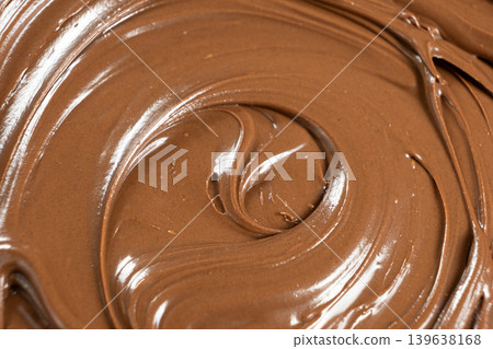 Creamy delicious chocolate melted cream texture background Creamy delicious chocolate melted cream texture background 139638168