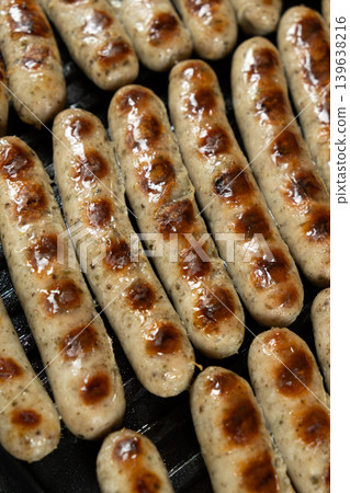 Batch of Sausages Roasting on Modern Electric Home Grill Batch of Sausages Roasting on Modern Electric Home Grill 139638216