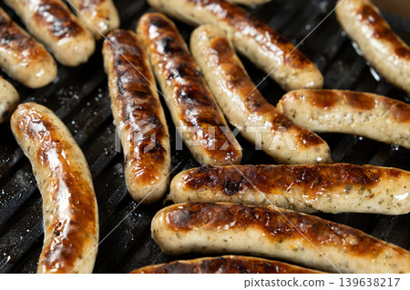 Batch of Sausages Roasting on Modern Electric Home Grill Batch of Sausages Roasting on Modern Electric Home Grill 139638217