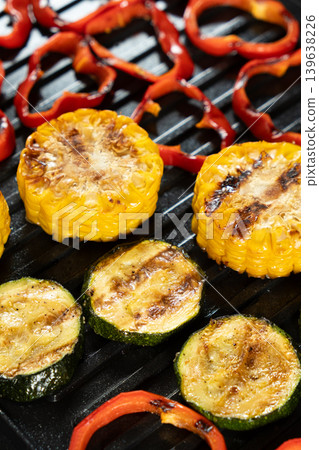 Assorted vegan grilled food background with colorful vegetables Assorted vegan grilled food background with colorful vegetables 139638226
