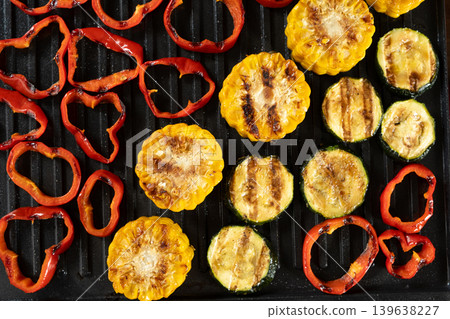 Assorted vegan grilled food background with colorful vegetables Assorted vegan grilled food background with colorful vegetables 139638227