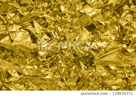 Luxury shiny metallic golden foil crumpled texture background 139638351