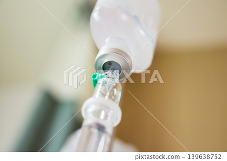 Close up medical intravenous IV drip in hospital background Close up medical intravenous IV drip in hospital background 139638752