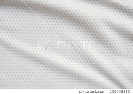 White sports clothing fabric football shirt jersey texture abstract background White sports clothing fabric football shirt jersey texture abstract background 139638810