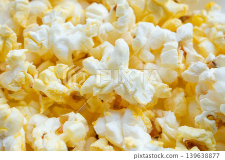 Tasty popcorn close up background top view Tasty popcorn close up background top view 139638877