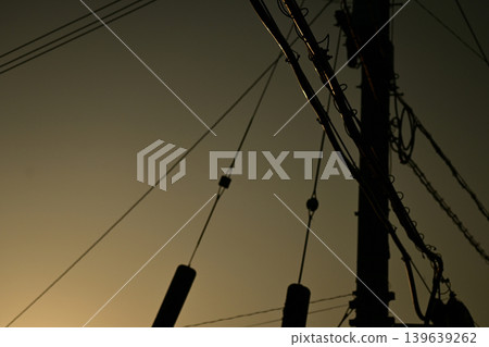 Electric pole at dusk Electric pole at dusk 139639262