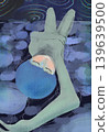 A person sleeping in a quiet blue space 139639500