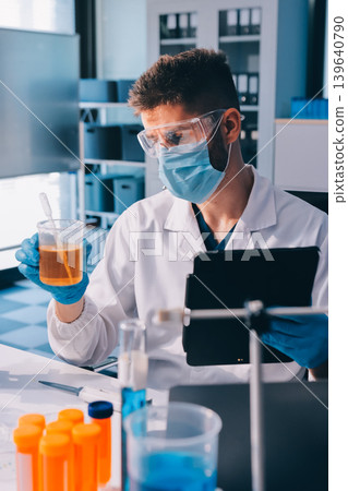 Lab technician experimenting in lab Lab technician experimenting in lab 139640790
