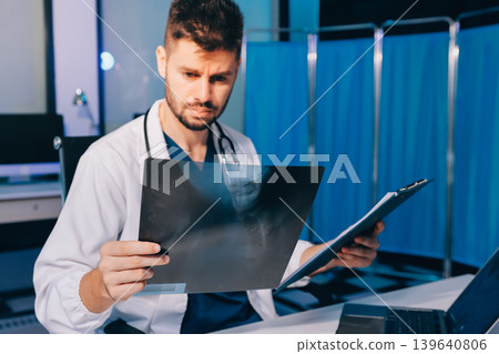 Man, doctor and laptop typing in healthcare research, communication or social media at office desk. Male medical expert working on computer in online search, browsing or chatting on tablet at clinic Man, doctor and laptop typing in healthcare research, communication or social media at office desk. Male medical expert working on computer in online search, browsing or chatting on tablet at clinic 139640806