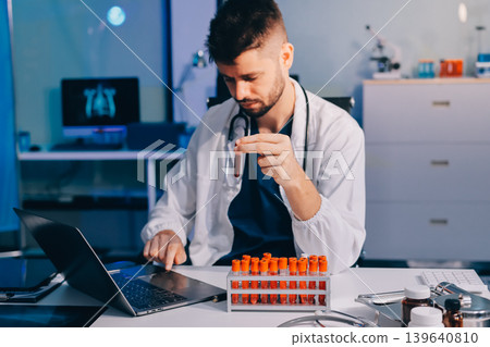 Attractive student of chemistry working in laboratory Attractive student of chemistry working in laboratory 139640810