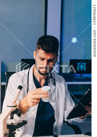 Attractive student of chemistry working in laboratory 139640821